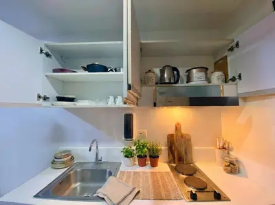 a kitchen with a sink and a counter top at Air Residences 49F City View, Wifi & Netflix in Manila