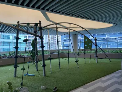 a playground in an office building with a swing at Air Residences 49F City View, Wifi & Netflix in Manila