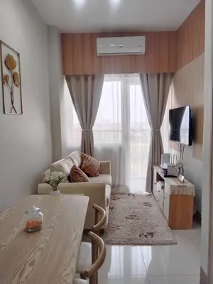 a living room with a couch and a table at Feel at Home in Manila
