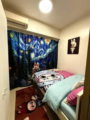 a bedroom with two twin beds and a large window at Wonder Collective Stays in Manila