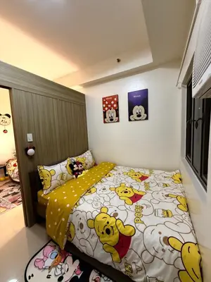 a small bedroom with a winnie the pooh bed at Wonder Collective Stays in Manila