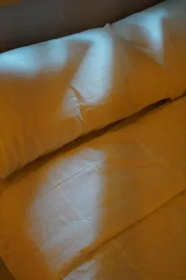 a close up of a pillow on a bed at SMDC LIGHT Balcony Smart TV Alexa Cozy Retreat in Manila