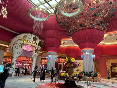 a large lobby with large chandaliers in a shopping mall at Seaview 2BR CondoteI Near Airport,NAIA, MOA ,Okada Casino in Manila