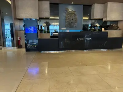 a lobby of a shopping center with a store at Shore Balcony MOA Price worthy Wifi Pool Netflix in Manila