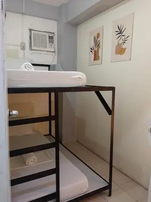 a room with a bunk bed and a sink at SL Bedspace Transient House in Manila