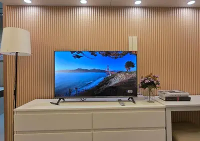 a flat screen tv sitting on top of a dresser at Posh & Chic Suite 1 Bedroom Mall of Asia Airport in Manila