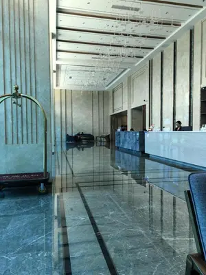 a lobby with a swimming pool in a building at Sy bay suites Near Ayala mall PITX DFA T3T2 Okada MSV2106 in Manila