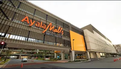 a large building with a walmart sign on it at Sy bay suites near PITX NAIA Airport T3 MOA Okada MSV2107 in Manila