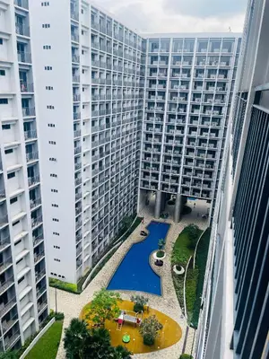 a view from the balcony of a large apartment building at H&M condotel in Manila