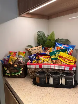 a kitchen counter with a bunch of chips and other snacks at Hotel Residence at Novotel in Manila