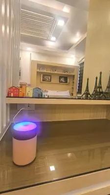 a room with a room with a bed and a stool at Urban Haven Manila in Manila