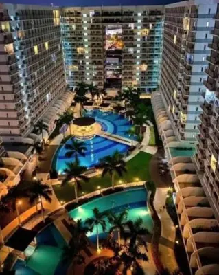 an overhead view of a large building with a pool at Staycation in Pasay near Moa in Manila