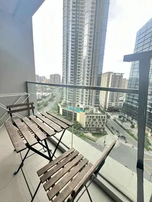 a balcony with a bench and a view of a city at Elegant Central 1BR BGC 11P Uptown Parksuites T2 in Manila