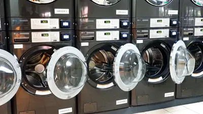 a bunch of washers and dryers in a store at Midhaven Suite in Manila