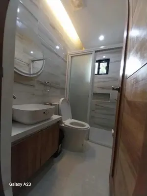 a bathroom with a toilet and a sink and a shower at Sehaliah Agricultural Farm Resort in Amadeo