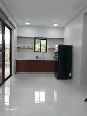 a large kitchen with a sink and a counter at Sehaliah Agricultural Farm Resort in Amadeo