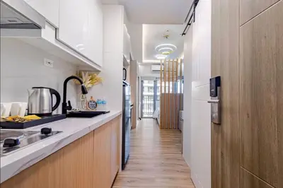 a kitchen with a sink and a counter at EJs Crib Cozy 1BR Condo at SMDC Fame Residences in Manila