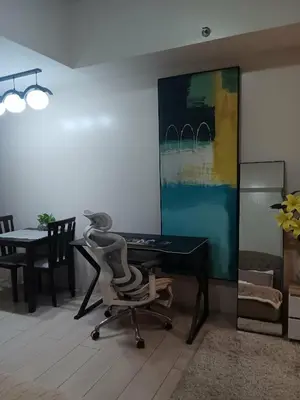 a office with a desk and a chair in a room at Spacious Studio 3B C5 in Manila
