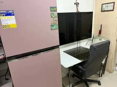an office with a desk with a chair and a laptop at Light Residences by SMDC Boni MRT EDSA in Manila