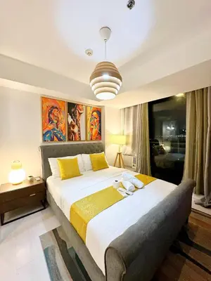 a bedroom with a large bed in a room at 1BR Condotel in Azure Urban Resort near NAIA #TRO4 in Manila