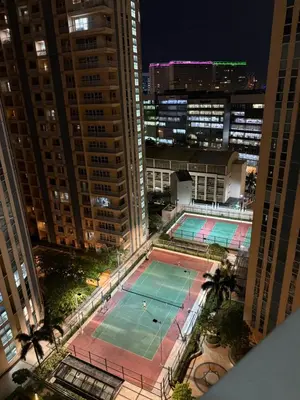 an overhead view of a tennis court in a city at Venice Luxury Residences Emanuele in Manila