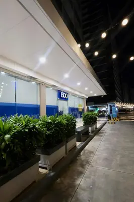 a building with a row of potted plants at Staycation near NAIA, MOA with PS4, Netflix & Karaoke in Manila