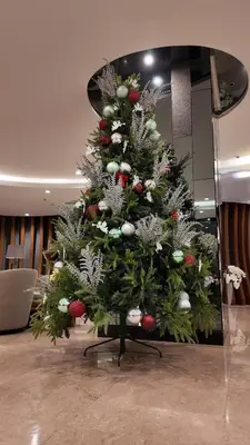 a christmas tree on display in a room at Staycation near NAIA, MOA with PS4, Netflix & Karaoke in Manila