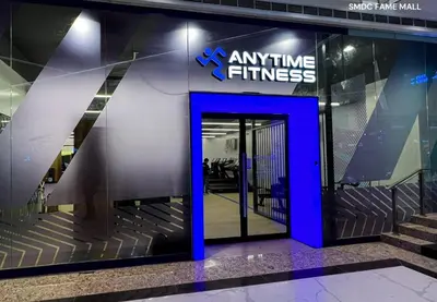 an entrance to an office building with a blue door at JL's City Hideaway at Fame Residences in Manila