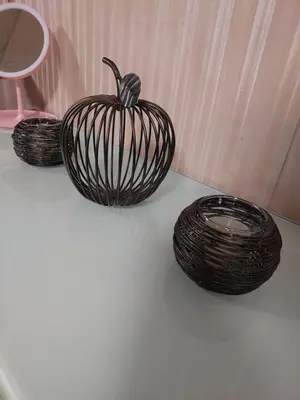 three baskets with a pumpkin on top of a table at Condotel SM MOA sea residences in Manila