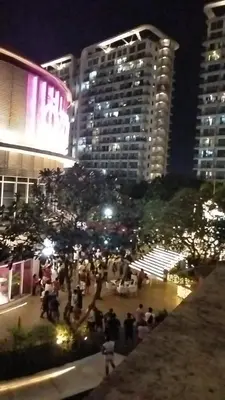 a group of people in a city at night at OasisStaycation in Manila