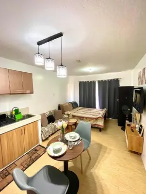 a living room with a couch and a table at Secret Nest in Manila