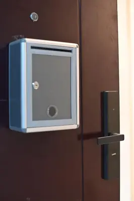 a door with a television on the side of it at G & J Serene Suites in Tanza