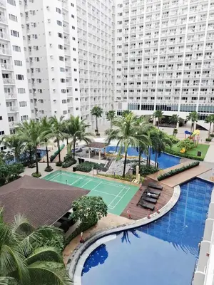 an overhead view of a tennis court and buildings at Oasis at Shore Residences in Manila