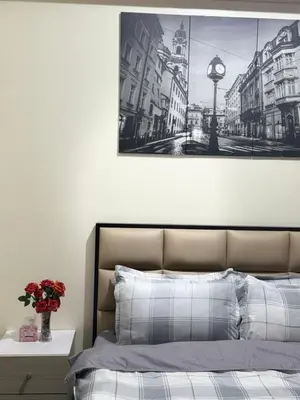 a bedroom with a bed with a picture on the wall at 81 Newport Across International Airport Terminal 3 C1-7O in Manila
