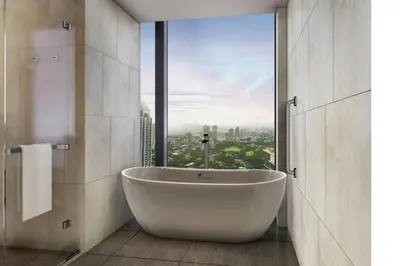 a bathroom with a tub and a large window at AC Hotel by Marriott Manila in Manila