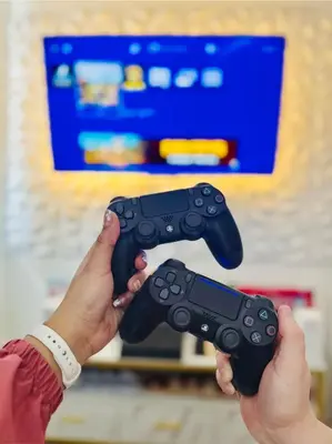 two people holding video game controllers in their hands at Azure Urban Resort Residences, 1BR Bahamas 15th floor in Manila