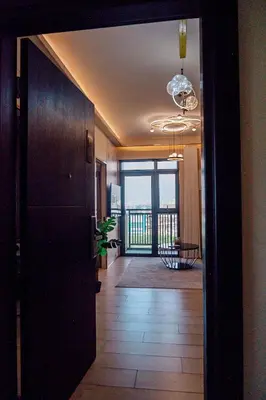 a hallway with a door to a room with a balcony at Premium Condo units at Gentry Manor beside Okada Manila and near Airport in Manila