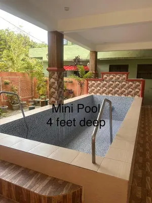 a mini pool feet deep in a house at Jarens Diner in Silang