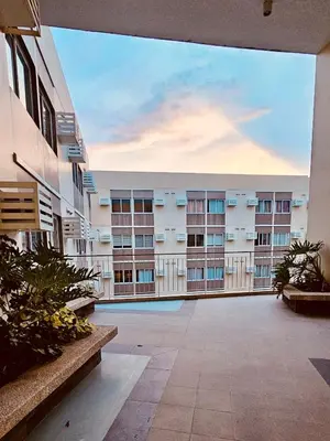 a view of an apartment building from the courtyard at Your Cozy Space in Stanford Suites 3 Brgy Inchican Silang Cavite in Silang