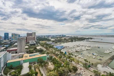 an aerial view of a harbor with boats in the water at Admiral Baysuites 2602 in Manila