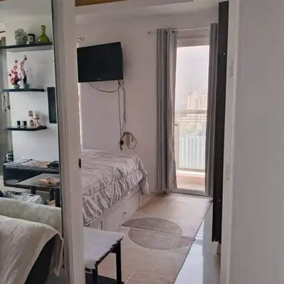 a small bedroom with a bed and a window at Manila Skyview suite at Birch tower condo in Manila