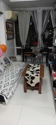 a bedroom with a bed and a table with a cow blanket at Manila Skyview suite at Birch tower condo in Manila