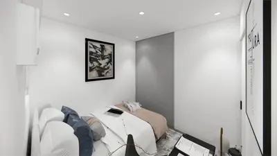 a white bedroom with a bed and a couch at Staycation by Carmen Romualdo in Manila
