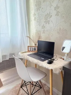 a laptop computer sitting on a desk with a chair at Azure Urban Resort Residences in Manila