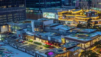 an overhead view of a city at night at Uptown Parksuites Balcony Mall View in Manila