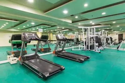 a gym with treadmills and elliptical machines at Manila bay view condo birch tower in Manila
