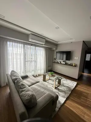 a living room with a couch and a large window at Exquisite Property Stays at Acacia Estate Taguig City in Manila