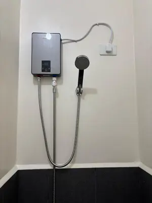 a bath room with a shower at Cozy Staycation in Cubao with Netflix in Manila