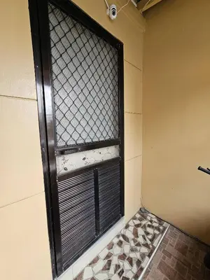 a window with black blinds in a room at Cozy Bian Getaway - Entire House for Rent in Biñan