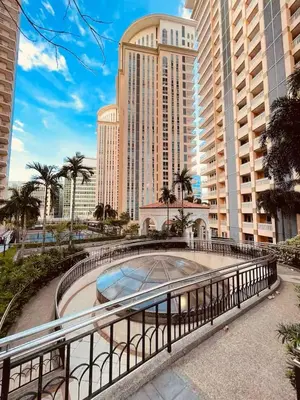 a walkway in front of a large building at Canal View Luxury Stay, Studio type , Massage Chair, Office Desk in Manila